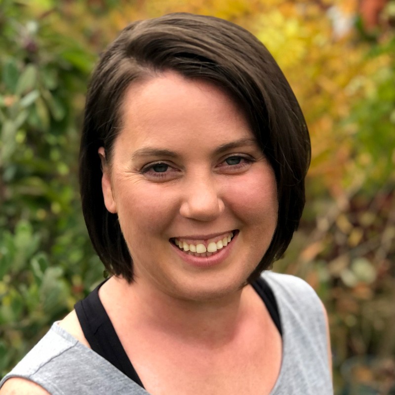 Smiling woman with short dark brown hair